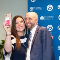 man and woman selfie at photo station